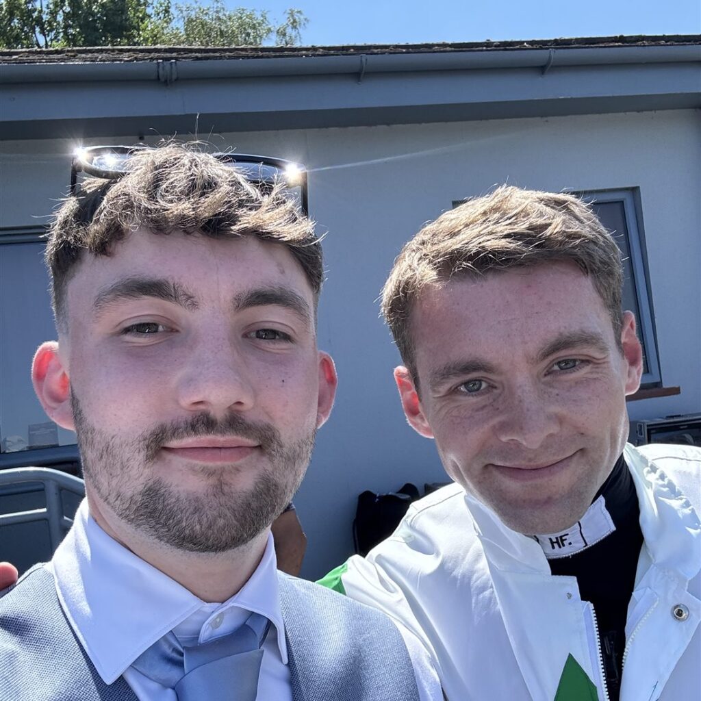 Luke from The Furlong Fellas taking a selfie with a jockey at the racecourse